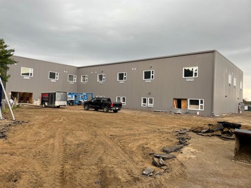 Partially completed exterior of Phase 3 (1st floor) and Phase 2 (2nd floor).